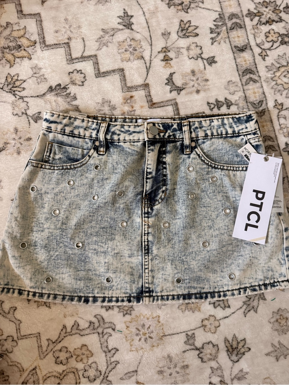 PTCL Light Blue Acid-Wash Denim Mini Skirt with Silver Eyelets